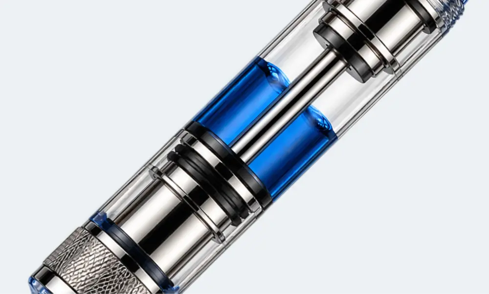 Mécanisme à piston intégré rempli d’encre bleue